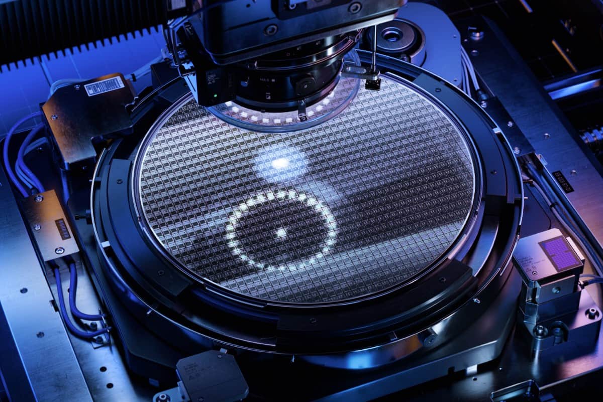 Semiconductor wafer under inspection inside precision fabrication equipment during microchip manufacturing process